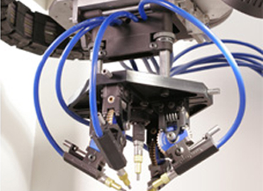 5-nozzle blast head on Comco Automated MicroBlasting System