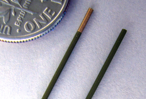Coating precisely removed from tip of guidewire.