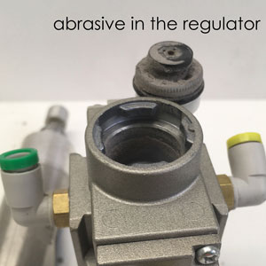 damaged regulator - abrasive invasion due to pressure imbalance
