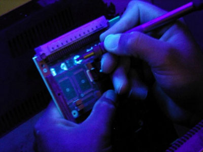 Conformal coating removal with or without blacklight
