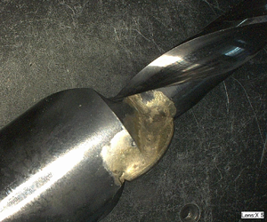 Excess brazing material around carbide insert on cutting tool (5x)